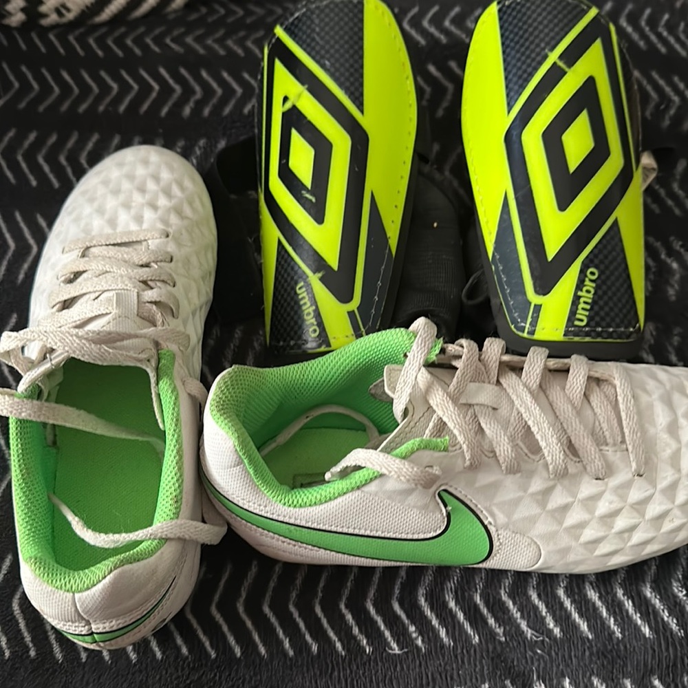 Kids NIKE soccer cleats and shin guards.